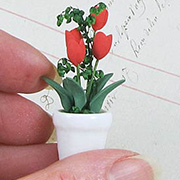 Red Tulips in White Flower Pot